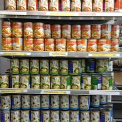 Thai Supermarked - Rows of red and green curry paste and tom yum paste