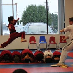 World Martial Arts - Everyone enjoys our demo team performances, with acts such as this flying side kick over six people.
