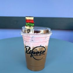 Riposo Coffee Roasters - Rainbow Cookie Latte, with homemade raspberry almond cold foam & a rainbow cookie