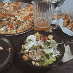 Round Table Pizza - Half pepperoni pizza & half combination, salad & classic wings.