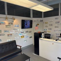 DMV San Diego - Empty lobby. Worker working on my paperwork behind the desk.