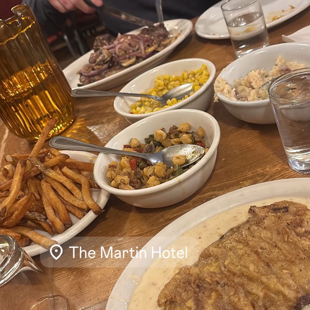 chicken fried steak, t bone steak, fries, sides of corn, mashed potatoes and hominy and chick pea succotash