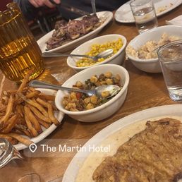 chicken fried steak, t bone steak, fries, sides of corn, mashed potatoes and hominy and chick pea succotash chicken fried steak, t bone steak, fries, sides of corn, mashed potatoes and hominy and chick pea succotash