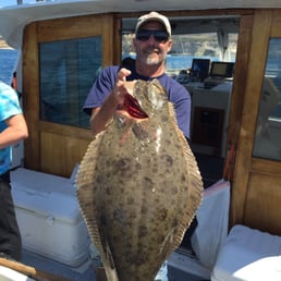 Captain Joe and the 30 lb Halibut the was caught during our trip.
