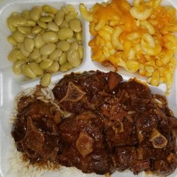 MY Brother's Soulfood - Oxtail dinner on bed of white rice & sides of lima beans and macaroni & cheese
