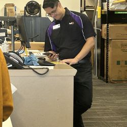 FedEx Office Print & Ship Center - The guy in the photo was so self engrossed in his phone