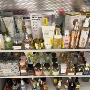 TJ Maxx - Perfume - Store shelves hold skincare, perfume, and beauty products, including facial hair remover, body cleansing foam, hand cream, and fragrances. - Department Stores Near Me - Winchester, Kentucky