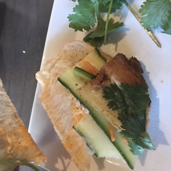 CO - One bite of meat on half a bahn mi - Asian Fusion Near Me - Charlotte, North Carolina
