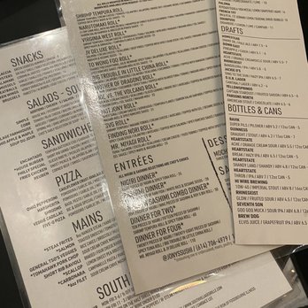 jony's sushi - Lots to choose from - The menu includes sections for specialty sushi rolls such as Shrimp Tempura, Virginia West, and Hot Jon Roll, along with salads, sandwiches, pizza, and main courses like steak frites and salmon. It also offers a variety of drinks including cocktails, beers, and non-alcoholic options. The menu is printed on paper with clear headings and item descriptions, suitable for a restaurant setting. - Sushi Bars Near Me - Columbus, Ohio