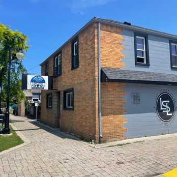 Lake Street Local - a brick building on the corner - Cocktail Bars Near Me - Port Austin, Michigan Lake Street Local - a brick building on the corner - Cocktail Bars Near Me - Port Austin, Michigan