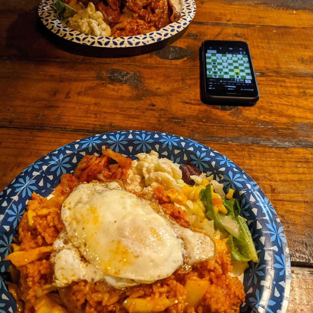 Yellow Kitchen - two plates of food on a wooden table - Food Trucks Near Me - Waipahu, Hawaii Yellow Kitchen - two plates of food on a wooden table - Food Trucks Near Me - Waipahu, Hawaii
