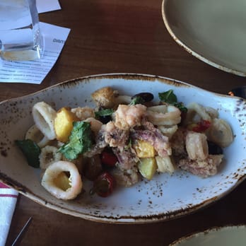 Dante - Fried squid with Calabrian chili, honey and balsamic glaze, mint, fried potatoes and olives. - Italian Near Me - Omaha, Nebraska