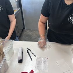 Pokemoto-Oxford - Employees wearing shirts with new name Fresh Chef - - name of restaurant changed early 2026