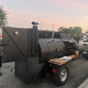 Ptrain's Ca BBQ - two men standing next to a bbqqqqqqqqqqqqq - Barbeque Near Me Ptrain's Ca BBQ - two men standing next to a bbqqqqqqqqqqqqq - Barbeque Near Me
