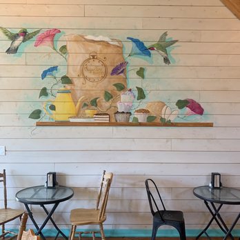 Sugar Time Bakery - tables and chairs in front of a painted mural - Bakeries Near Me - Enterprise, Oregon Sugar Time Bakery - tables and chairs in front of a painted mural - Bakeries Near Me - Enterprise, Oregon