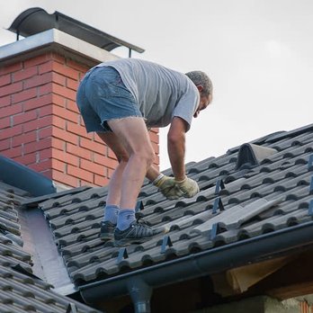 Xcel Construction & Remodeling - a man working on a roof - Roofing Near Me Xcel Construction & Remodeling - a man working on a roof - Roofing Near Me