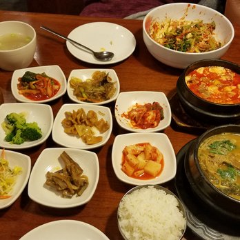 Musiro - Bulgogi, side dishes, bibimbap (already started), kimchi stew (top right), and hangover stew (bottom right.) All extremely delicious! - Korean Near Me - Carrollton, Texas Musiro - Bulgogi, side dishes, bibimbap (already started), kimchi stew (top right), and hangover stew (bottom right.) All extremely delicious! - Korean Near Me - Carrollton, Texas
