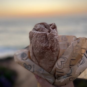 Locali - a person holding a pastry in their hand - Sandwiches Near Me - San Diego, California