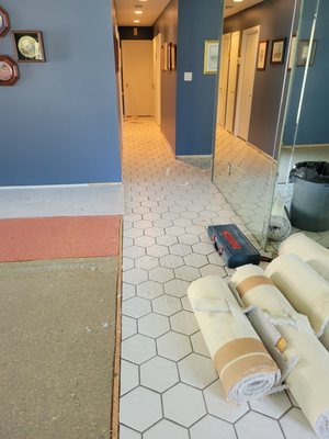 Flooring - Manufactured flooring installation which once housed tile flooring.
