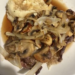 Red Rooster Cafe and Catering - Ribeye Steak smothered in onions and mushrooms