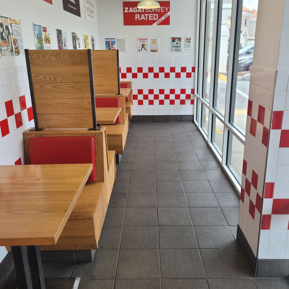 Five Guys - a row of booths in a fast food restaurant - Burgers Near Me - Jacksonville, Florida Five Guys - a row of booths in a fast food restaurant - Burgers Near Me - Jacksonville, Florida