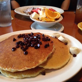 Tiffany's Restaurant - Wonderfully large chocolate chip pancakes! Bananas, whipped cream and strawberries on the side scrumptious - New American Near Me - Palm Harbor, Florida Tiffany's Restaurant - Wonderfully large chocolate chip pancakes! Bananas, whipped cream and strawberries on the side scrumptious - New American Near Me - Palm Harbor, Florida
