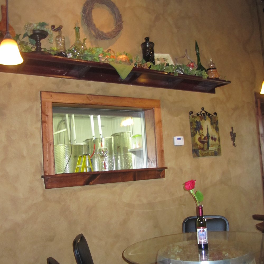 Ladoga Ridge Winery - Neat little window from the tasting room into the room with the tanks where the wine is made. - Wineries Near Me - Smithville, Missouri Ladoga Ridge Winery - Neat little window from the tasting room into the room with the tanks where the wine is made. - Wineries Near Me - Smithville, Missouri