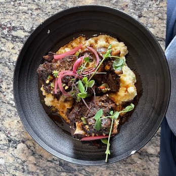 Lucille's - Braised Oxtail with grits. Yum! - New American Near Me - Houston, Texas Lucille's - Braised Oxtail with grits. Yum! - New American Near Me - Houston, Texas