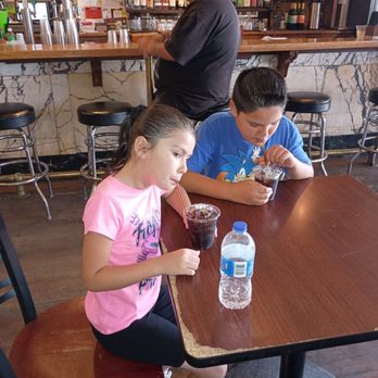 Delta Restaurant - Kids loving their housemade sarsaparilla - Bars Near Me - Virginia City, Nevada
