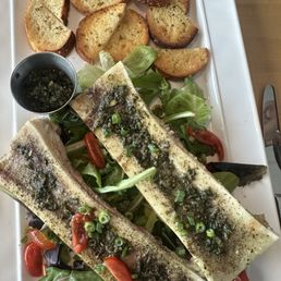 Bone marrow with a chimichurri sauce. Bone marrow with a chimichurri sauce.