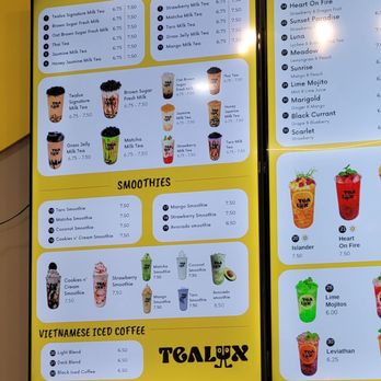 Tealux Cafe - A menu board at Tealux Cafe listing various milk teas, smoothies, and Vietnamese iced coffee drinks with prices. - Bubble Tea Near Me - Ballwin, Missouri