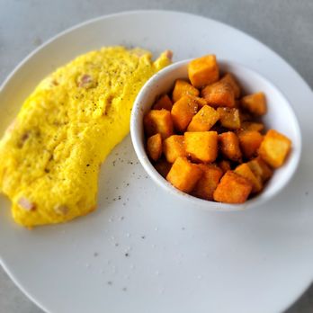 Brick & Spoon - Orange Beach - The omelet was perfect and fluffy!  These breakfast potatoes were on point! - Breakfast & Brunch Near Me - Orange Beach, Alabama