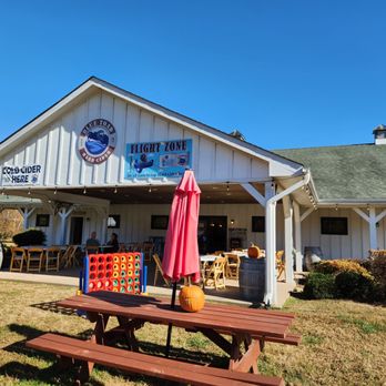 Blue Toad Hard Cider - a picnic table and umbrella - Cideries Near Me - Roseland, Virginia