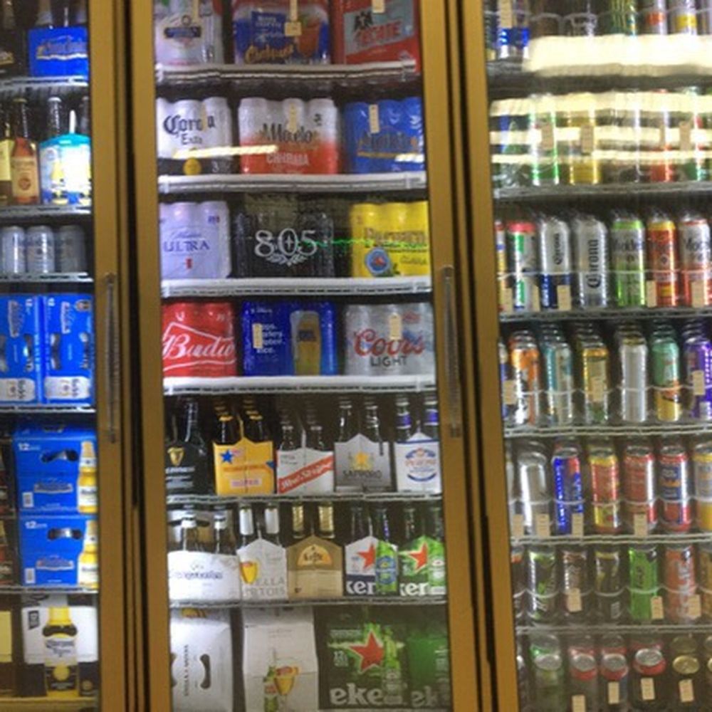 First Mart - a row of beer bottles in a glass case - Convenience Stores Near Me - San Jose, California First Mart - a row of beer bottles in a glass case - Convenience Stores Near Me - San Jose, California