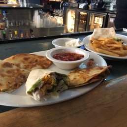 Cowboy quesadilla, turkey avocado wrap w/fries. We split everything, it didn't come plated this way =) Cowboy quesadilla, turkey avocado wrap w/fries. We split everything, it didn't come plated this way =)