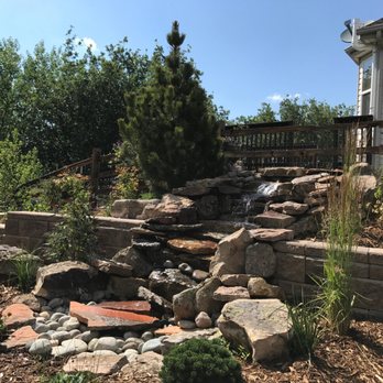Residential Landscape - a garden with a waterfall - Landscaping Near Me Residential Landscape - a garden with a waterfall - Landscaping Near Me