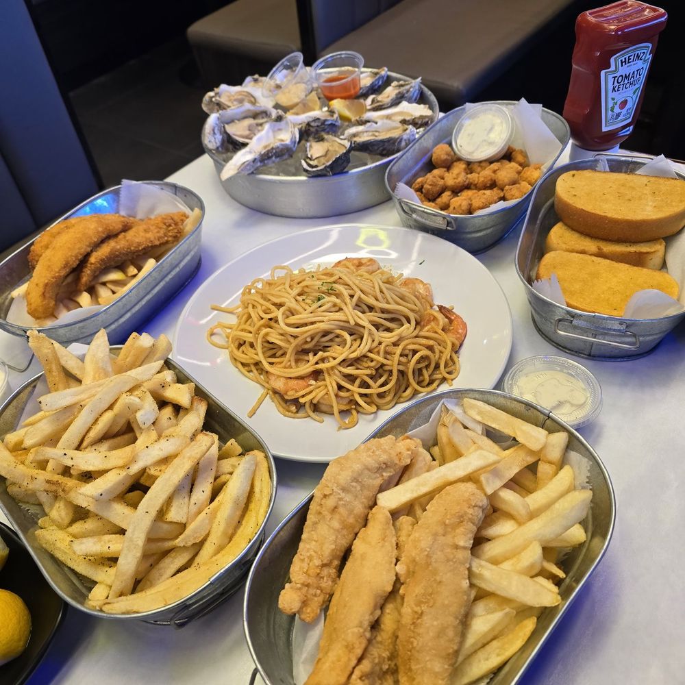 Catfish, chicken tenders, oysters, garlic noodles, garlic noodles, and popcorn chicken