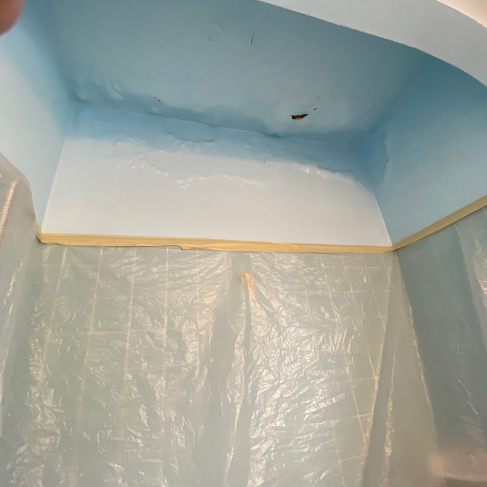 Patchwork's Plastering & Patching Specialists - Water damaged ceiling to be repaired, surrounding area fully prepped to protect the tub, plumbing, and work area. - Stucco Services Near Me Patchwork's Plastering & Patching Specialists - Water damaged ceiling to be repaired, surrounding area fully prepped to protect the tub, plumbing, and work area. - Stucco Services Near Me