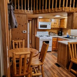 Baker Cabins - New flooring. Dining and kitchen
