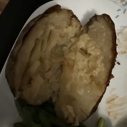 This is the baked potato that I was given. I complained about it being brown, and again the manager justified it. It tasted very old. This is the baked potato that I was given. I complained about it being brown, and again the manager justified it. It tasted very old.
