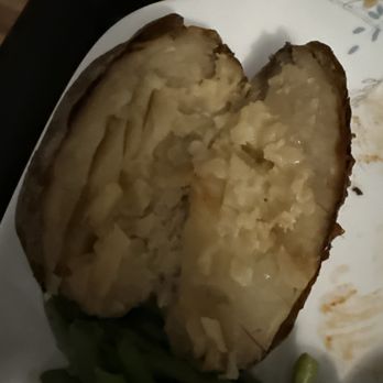 Stanford's - This is the baked potato that I was given. I complained about it being brown, and again the manager justified it. It tasted very old. - American Near Me - Seattle, Washington Stanford's - This is the baked potato that I was given. I complained about it being brown, and again the manager justified it. It tasted very old. - American Near Me - Seattle, Washington