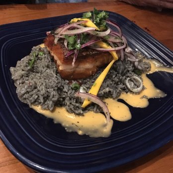 Puerto 27 Peruvian Kitchen & Pisco Bar - Salmon with squid ink rice. Perfectly cooked. - Peruvian Near Me - Pacifica, California Puerto 27 Peruvian Kitchen & Pisco Bar - Salmon with squid ink rice. Perfectly cooked. - Peruvian Near Me - Pacifica, California