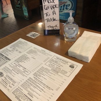 Uncle Al's - Hand sanitizer, napkins, paper menu, code to scan for menu and a sign for seating capacity. - American Near Me - Davie, Florida Uncle Al's - Hand sanitizer, napkins, paper menu, code to scan for menu and a sign for seating capacity. - American Near Me - Davie, Florida