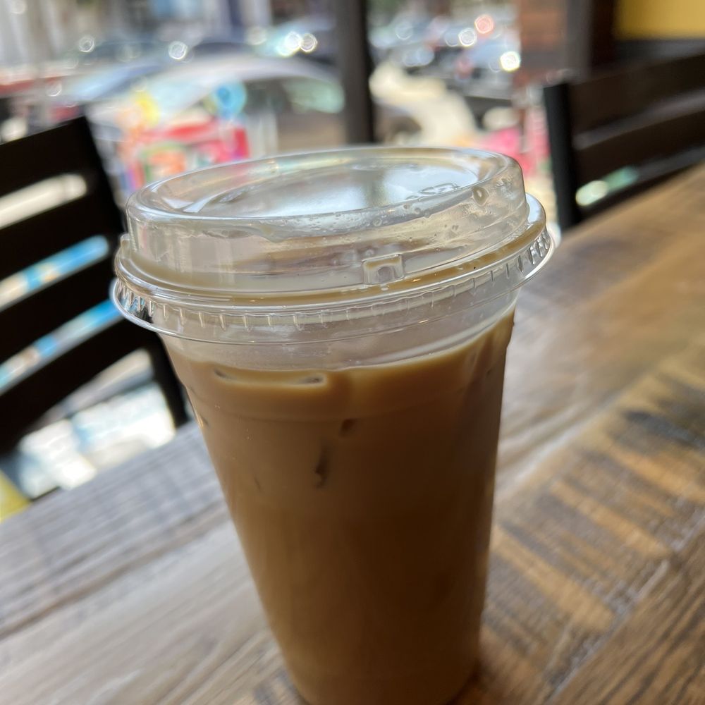 Yinz Coffee - Iced purple rain latte with oat milk in a large cup - Coffee & Tea Near Me - Pittsburgh, Pennsylvania Yinz Coffee - Iced purple rain latte with oat milk in a large cup - Coffee & Tea Near Me - Pittsburgh, Pennsylvania