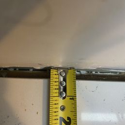 Gap between countertop and wall.