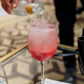 The Library Bar - a person pouring a drink into a glass - Cocktail Bars Near Me - Philadelphia, Pennsylvania The Library Bar - a person pouring a drink into a glass - Cocktail Bars Near Me - Philadelphia, Pennsylvania