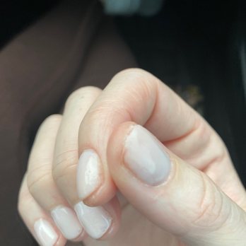 Sassy Nail & Spa - a woman's hand with white nails - Nail Salons Near Me - Portage, Indiana