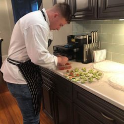 Local Source Catering Services - Preparing cucumber bite sized appetizer filled with pico de gallo, corn salsa, cilantro sauce