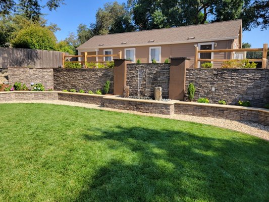 Backyard stone veneer project - This project created a level lawn area with double tiered seating & retaining walls with stone veneer and sheer decent. Backyard stone veneer project - This project created a level lawn area with double tiered seating & retaining walls with stone veneer and sheer decent.