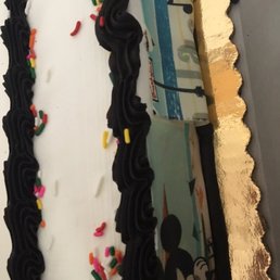 Messed up siding with edible image and BLACK border for a Disney birthday.